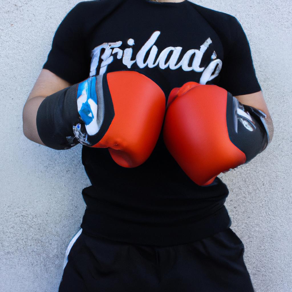 Person holding boxing gloves, posing