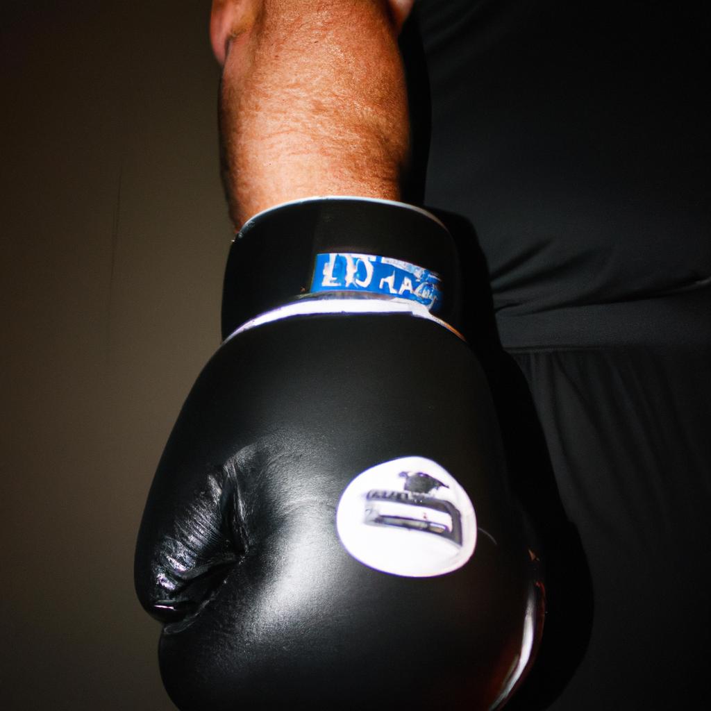Person holding boxing gloves, demonstrating