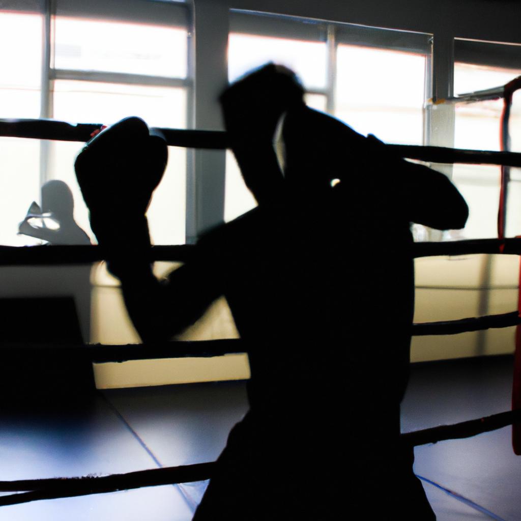 Person shadow boxing in gym