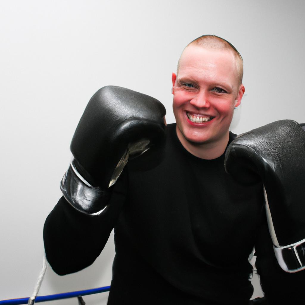 Person holding boxing gloves, smiling